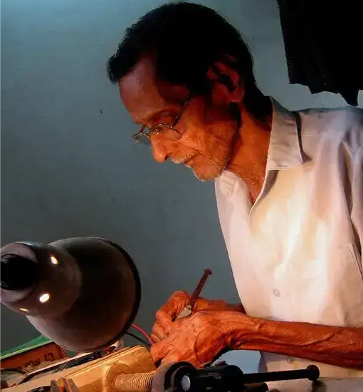 Artisan working on a handcrafted lighting piece
